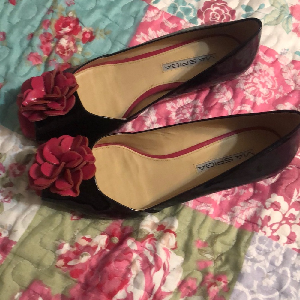 Via Spiga black peep toe with pinkish flower at the toe.